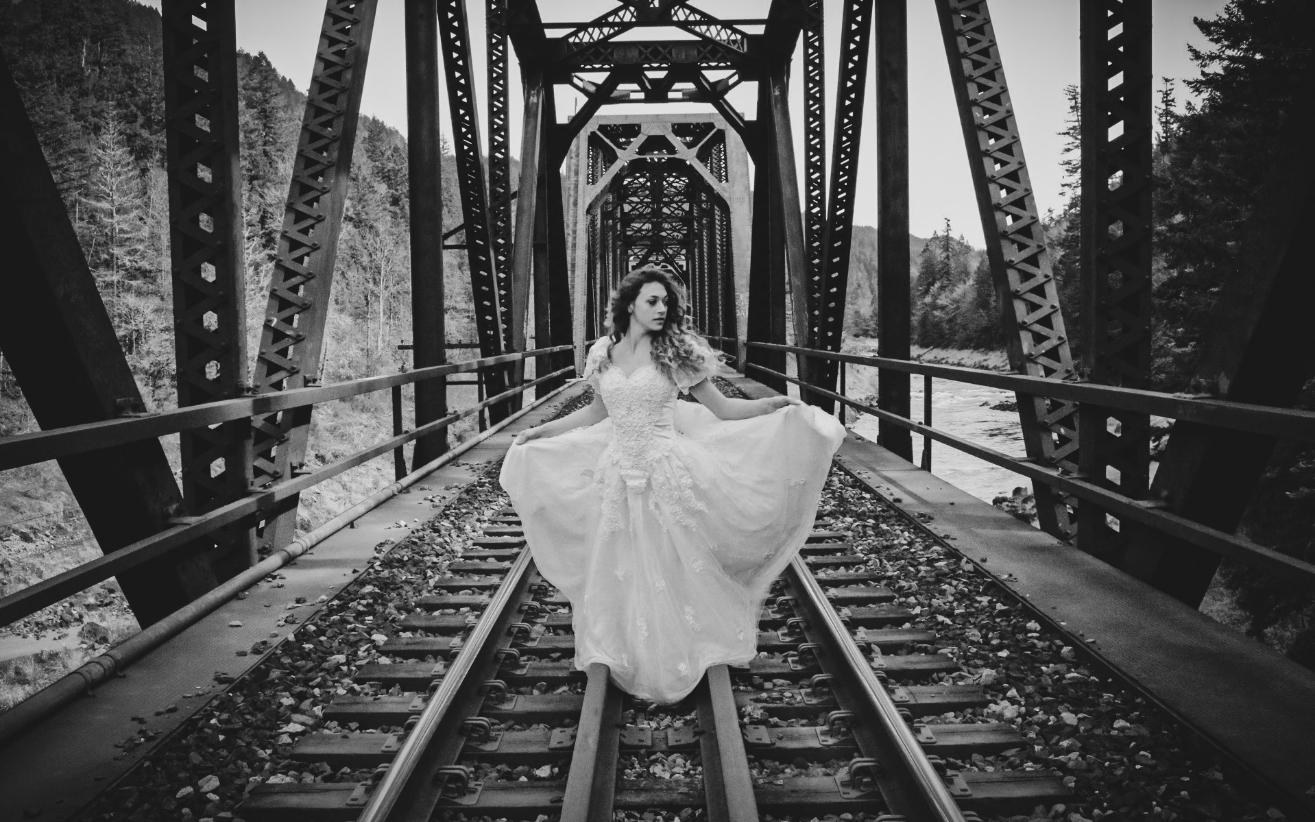 Bridal portrait on railroad bridge